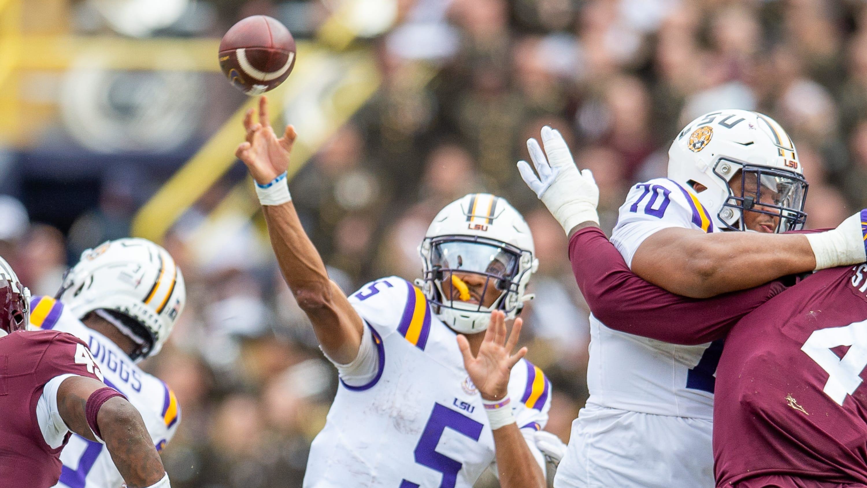 LSU quarterback Jayden Daniels throws a pass.