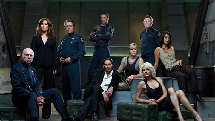 BATTLESTAR GALACTICA -- Season 3 -- Pictured: (l-r) Michael Hogan as Colonel Saul Tigh, Mary McDonnell as President Laura Roslin, Edward James Olmos as Admiral William Adama, Jamie Bamber as Captain Lee "Apollo" Adama, James Callis as Dr. Gaius Baltar, Kattee Sackhoff as Lt. Kara "Starbuck" Thrace, Tahmoh Penikett as Captain Karl "Helo" Agathon, Grace Park as Number Eight, Tricia Helfer as Number Six -- (Photo by: Justin Stephens/Syfy/NBCU Photo Bank)