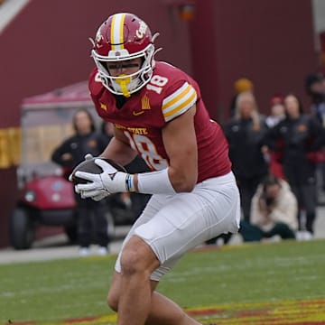Iowa State Cyclones' tight end Benjamin Brahmer (18) runs with the ball after making a catch ball around Arizona State Sun Devils linebacker Keyshaun Elliott (44) during the first quarter in the Big-12 showdown at jack Trice Stadium on Nov. 1, 2025, in Ames, Iowa.