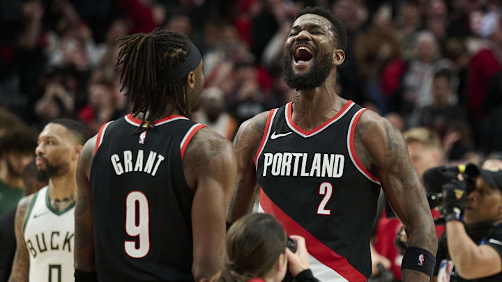 Jan 31, 2024; Portland, Oregon, USA; Portland Trail Blazers center Deandre Ayton (2) celebrates with forward Jerami Grant (9) after beating the Milwaukee Bucks at Moda Center. Mandatory Credit: Troy Wayrynen-Imagn Images