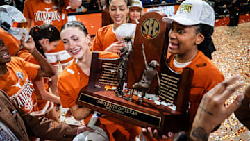 The Texas Longhorns, including Texas Longhorns guard Shay Holle (10) and forward Madison Booker (35) celebrate their regular season SEC Championship after beating Florida at home in the Moody Center, March 2, 2025.