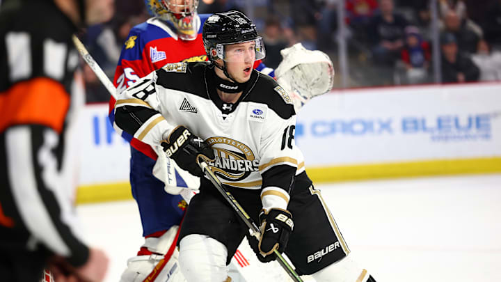 MONCTON, CANADA - FEBRUARY 21: Ivan Ryabkin #18 of the Charlottetown Islanders skates in front of Rudy Guimond #25 of the Moncton Wildcats during the second period at Avenir Centre on February 21, 2026 in Moncton, Canada. (Photo by Dale Preston/Getty Images)