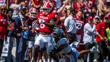 Indiana's Kaelon Black (8) avoids Old Dominion's Nickendre Stiger (2)during the Indiana versus Old Dominion football game at Memorial Stadium on Saturday, Aug. 30, 2025.