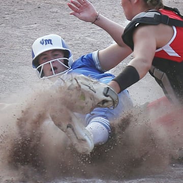 Van Meter's Finley Netten (sliding) is one of the top Iowa high school softball players in Class 2A.