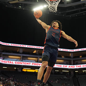 Brayden Burries of Roosevelt soars in for a dunk during the California (CIF) State Open Division title game at the Golden 1 Center in Sacramento.