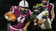 Mishawaka's Chase Gooden (44) attempting to evade Fort Wayne Snider's Brandon Logan (4) during Friday nights Regional game at Mishawaka. Fort Wayne Snider Mishawaka Football