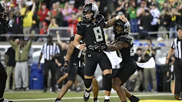 Oct 12, 2024; Eugene, Oregon, USA; Oregon Ducks quarterback Dillon Gabriel (8) celebrates with running back Jordan James (20) after scoring a touchdown during the second half against the Ohio State Buckeyes at Autzen Stadium. Mandatory Credit: Troy Wayrynen-Imagn Images