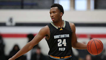 Huntington Prep guard Darryn Peterson takes the ball up the court during the first half at Canton Memorial Field House, Saturday, Feb. 17, 2024.