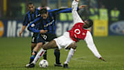 Kanu of Arsenal battles with Marco Materazzi of Inter Milan