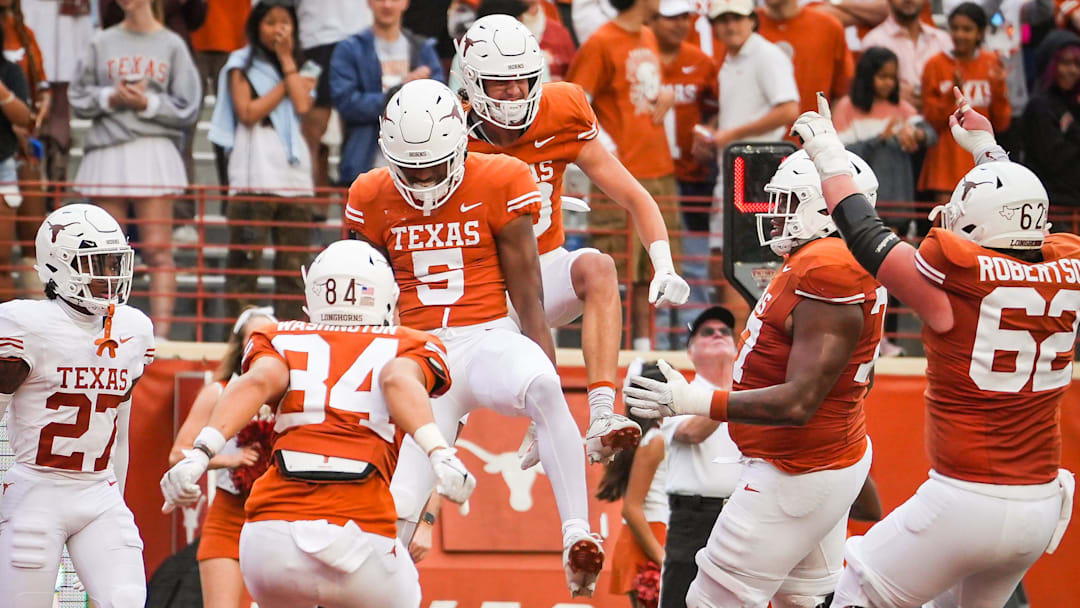 The Texas Orange team celebrate a touchdown catch by wide receiver Ryan Wingo (5) in the fourth quarter of the Longhorns' spring Orange and White game at Darrell K Royal Texas Memorial Stadium in Austin, Texas, April 20, 2024.