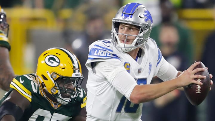 Green Bay Packers defensive tackle Devonte Wyatt chases Detroit Lions quarterback Jared Goff