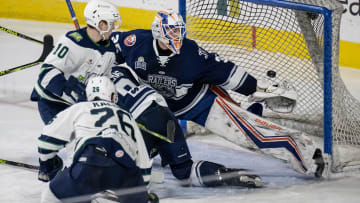 Railers goalie Ken Appleby watches as a shot from Maine's Nate Kallen slips by to put Maine up,