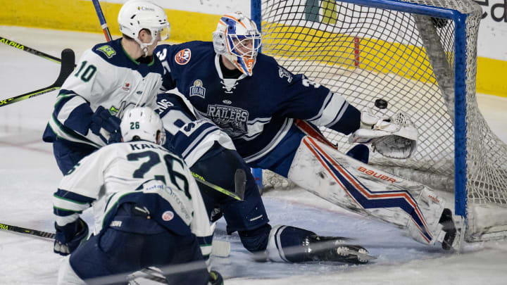 Railers goalie Ken Appleby watches as a shot from Maine's Nate Kallen slips by to put Maine up,