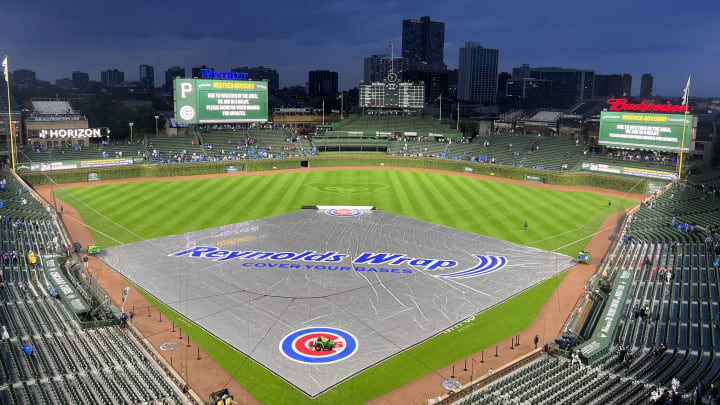 Sep 19, 2023; Chicago, Illinois, USA; A tarp sits on the field as the game between the Chicago Cubs