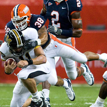 Sep 5, 2009; St. Louis, MO, USA; Illinois Fighting Illini linebacker Ian Thomas (38) sacks Missouri Tigers quarterback Blaine Gabbert (11) during the first half at the Edward Jones Dome. Missouri defeated Illinois 37-9. Mandatory Credit: Jeff Curry-Imagn Images