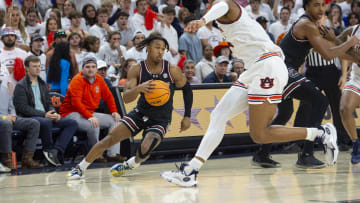 Meechie Johnson drives against Dylan Cardwell.