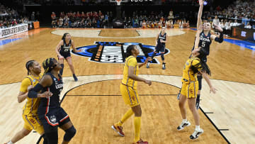 Apr 1, 2024; Portland, OR, USA; UConn Huskies guard Paige Bueckers (5) shoots a basket during the second half against USC Trojans guard Kayla Padilla (45) in the finals of the Portland Regional of the NCAA Tournament at the Moda Center. Mandatory Credit: Troy Wayrynen-USA TODAY Sports