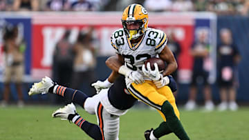 Sep 10, 2023; Chicago, Illinois, USA;  Green Bay Packers wide receiver Samori Toure (83) runs for a gain as Chicago Bears linebacker T.J. Edwards (53) hangs on for the tackle in the second half at Soldier Field.