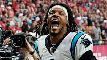 Former NFL quarterback Cam Newton yells \"I'm back!\" after scoring a touchdown for the Carolina Panthers