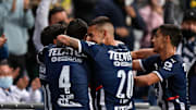 Jugadores de Rayados de Monterrey celebran un gol.