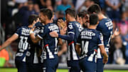 Jugadores de Rayados de Monterrey celebran un gol.