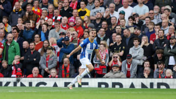 Leandro Trossard celebrates his hat-trick against Liverpool at Anfield