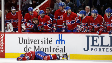 Max Pacioretty lies on the ice after being body-checked by Zdeno Chara.