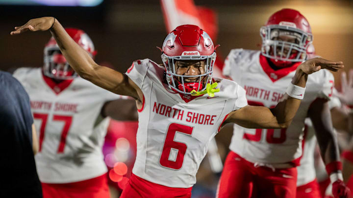 Devin Sanchez, the nation's No. 1 corner and a 5-star Ohio State commit, leads North Shore players onto the field.