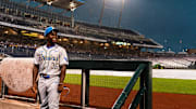 Jun 16, 2025; Omaha, Neb, USA; UCLA Bruins left fielder Dean West (36) sits in the dugout in the rain during a storm delay in the fourth inning against the LSU Tigers at Charles Schwab Field. Mandatory Credit: Dylan Widger-Imagn Images