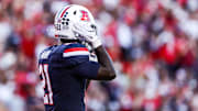 Sep 12, 2025; Tucson, Arizona, USA; Arizona Wildcats running back Ismail Mahdi (21) wears the retro helmet for the start of the game against the Kansas State Wildcats at Arizona Stadium. Mandatory Credit: Aryanna Frank-Imagn Images
