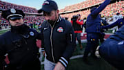 Ohio State Buckeyes head coach Ryan Day leaves the field shaking hands with Michigan Wolverines head coach Sherrone Moore, right, following the NCAA football game at Ohio Stadium in Columbus on Saturday, Nov. 30, 2024. Michigan won 13-10.