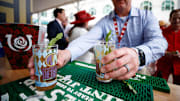 A man grabs a mint julep during the Kentucky Derby at Churchill Downs in Louisville, Kentucky.