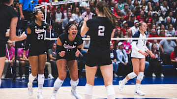 Nebraska players celebrate a point at Penn State. The Huskers swept the Nittany Lions for the second time on Friday night. 