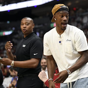 Apr 29, 2024; Miami, Florida, USA; Miami Heat forward Jimmy Butler (22) comments on the game from the bench during the first quarter of game four of the first round for the 2024 NBA playoffs, against the Boston Celtics, at Kaseya Center. Mandatory Credit: Michael Laughlin-Imagn Images