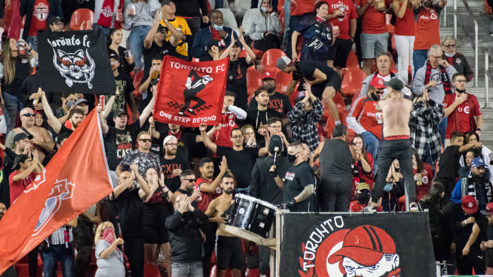 Toronto FC fans cheer during the MLS football match between...