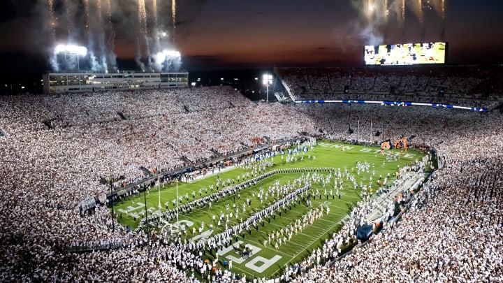 The Penn State football team runs onto the field to take on Auburn in a White Out game at Beaver Stadium. 