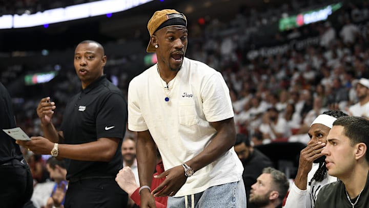 Apr 29, 2024; Miami, Florida, USA; Miami Heat forward Jimmy Butler (22) comments on the game from the bench during the first quarter of game four of the first round for the 2024 NBA playoffs, against the Boston Celtics, at Kaseya Center. Mandatory Credit: Michael Laughlin-Imagn Images