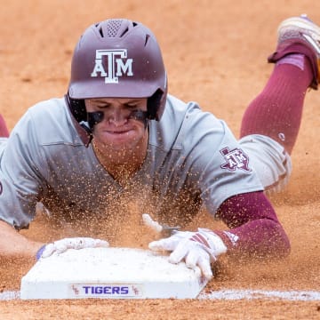 Aggies outfielder Caden Sorrell 13 slides into third as The LSU Tigers take on Texas A & M.