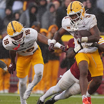 Arizona State Sun Devils running back Raleek Brown (3) battles for a few yards as getting tackle by Iowa State Cyclones' defensive back Josh Patterson (25) after making a first down during the fourth quarter in the Big-12 showdown at jack Trice Stadium on Nov. 1, 2025, in Ames, Iowa.
