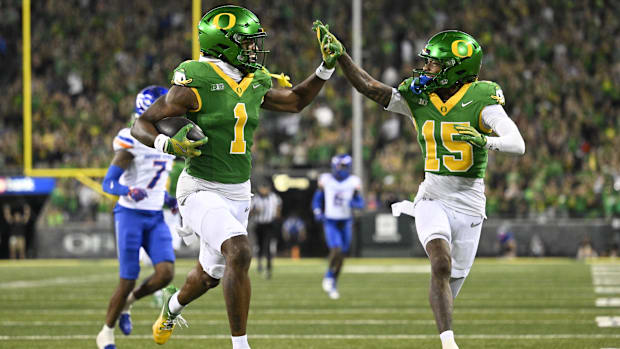 Oregon Ducks wide receiver Traeshon Holden (1) high-fives wide receiver Tez Johnson (15) as he scores a touchdown during the 