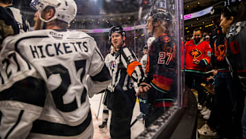 A referee steps in between Ontario defenseman Joe Hicketts (27) and Coachella Valley forward Ryan Winterton (27) during the first period of Game 2 of the Pacific Division Finals at Acrisure Arena in Palm Desert, Calif., Friday, May 17, 2024.