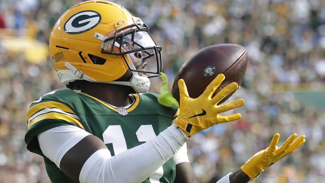  Green Bay Packers wide receiver Jayden Reed (11) catches a second-quarter touchdown pass against the Detroit Lions at Lambeau Field.
