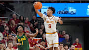 Iowa State Cyclones guard Curtis Jones (5) steals the ball from Baylor Bear guard Robert O. Wright III (1) during the first half in the NCAA men’s basketball at Hilton Coliseum on Saturday, Jan. 4, 2025, in Ames, Iowa.