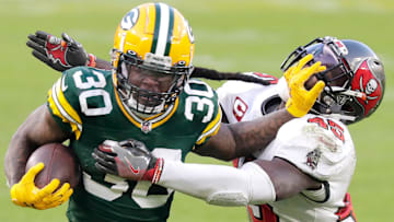 Green Bay Packers running back Jamaal Williams (30) rushes against the defense of Tampa Bay Buccaneers inside linebacker Devin White (45) during the NFC Championship game on Sunday, January 24, 2021, at Lambeau Field in Green Bay, Wis.Wm. Glasheen USA TODAY NETWORK-Wisconsin

Apc Packers Vs Bucs Nfc Champ 2327 012421 Wag