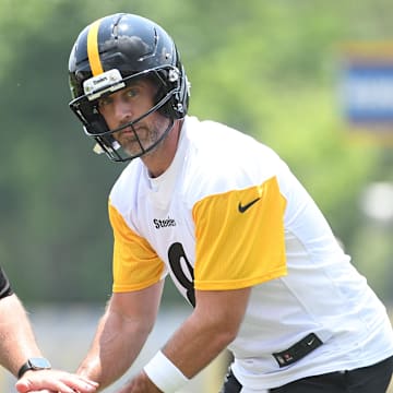 Jun 10, 2025; Pittsburgh, PA, USA;  Pittsburgh Steelers quarterback Aaron Rogers (8) takes a snap during minicamp at their South Side facility. Mandatory Credit: Philip G. Pavely-Imagn Images