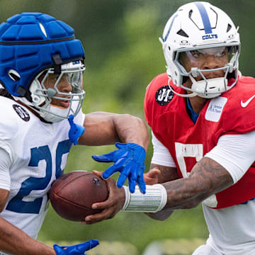 Indianapolis Colts quarterback Anthony Richardson Sr. (5) hands off to running back Jonathan Taylor (28) on Monday, July 28, 2025, during training camp held at Grand Park in Westfield.