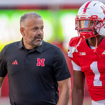 Matt Rhule and team captain Ceyair Wright converse on the sideline prior to kickoff against Akron. 