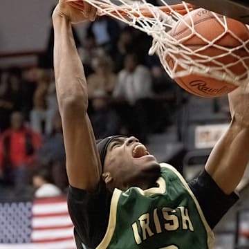 St.Vincent-St. Mary’s Elijah Chapman dunks during their game against McKinley on Tuesday, Dec. 2, 2025. Bob Rossiter / Special To The Canton Repository