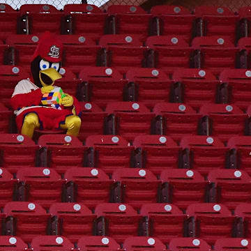 Sep 26, 2020; St. Louis, Missouri, USA;  St. Louis Cardinals mascot Fredbird attempts to solve a rubik s cube during the third inning of a game against the Milwaukee Brewers at Busch Stadium. Mandatory Credit: Jeff Curry-Imagn Images