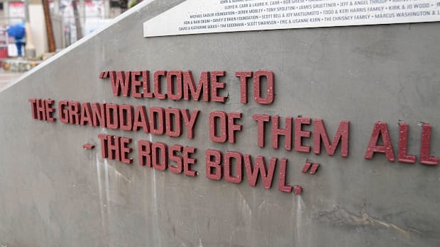 A sign honors broadcaster Keith Jackson outside the Rose Bowl stadium in Pasadena, Calif. on Dec. 30, 2021.